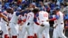 El equipo cubano celebra la victoria sobre Taiwán. (AP/I-Hwa Cheng)