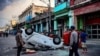 Una patrulla volteada por los manifestantes el 11 de julio, en La Habana. (Yamil Lage/AFP)
